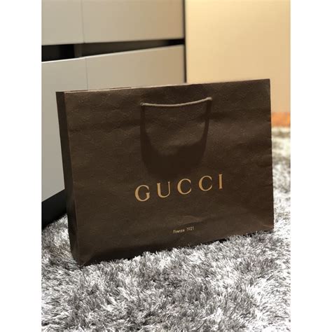 large gucci paper gift bag and box|Gucci paper shopping bag.